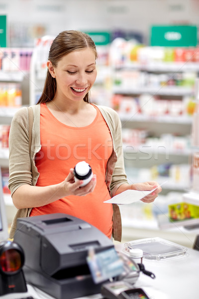 Feliz mulher grávida farmácia gravidez medicina Foto stock © dolgachov