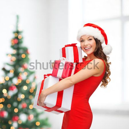 Gyönyörű szexi nő mikulás kalap vörös ruha emberek Stock fotó © dolgachov