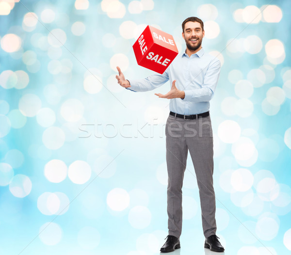 smiling man with red shopping bag Stock photo © dolgachov
