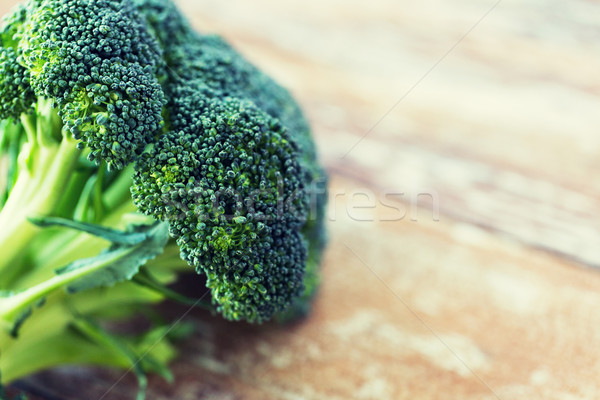 close up of broccoli on wooden table Stock photo © dolgachov