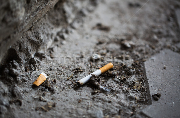 close up of smoked cigarette butt on ground Stock photo © dolgachov