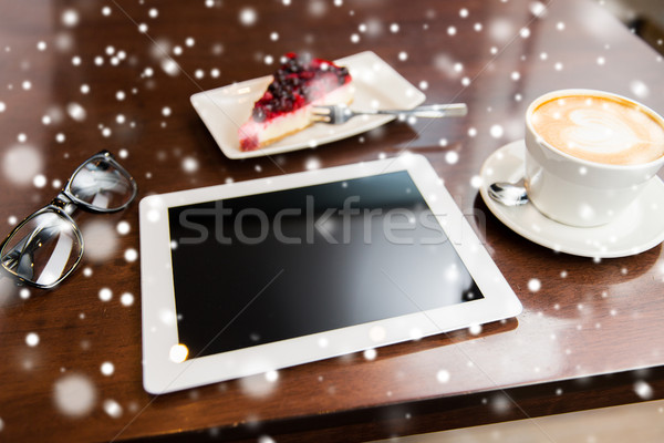 close up of tablet pc, coffee cup and cake Stock photo © dolgachov