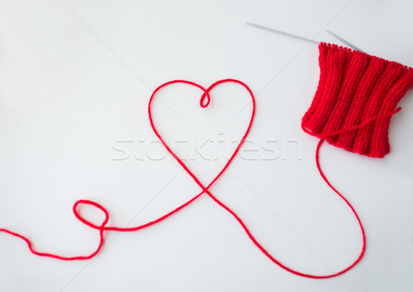 knitting needles and thread in heart shape Stock photo © dolgachov