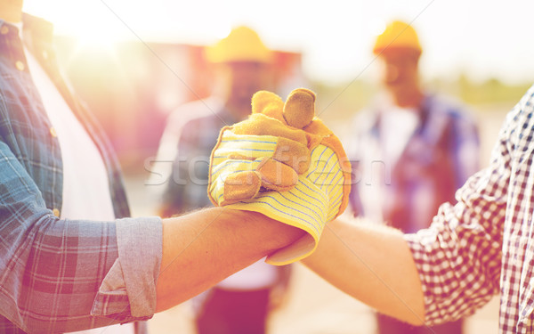 Stock fotó: Közelkép · építők · kezek · készít · kézfogás · épület