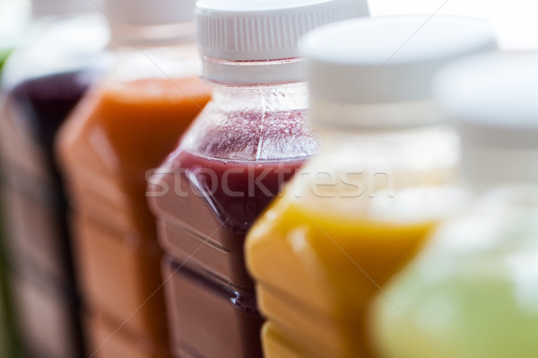 bottles with different fruit or vegetable juices Stock photo © dolgachov