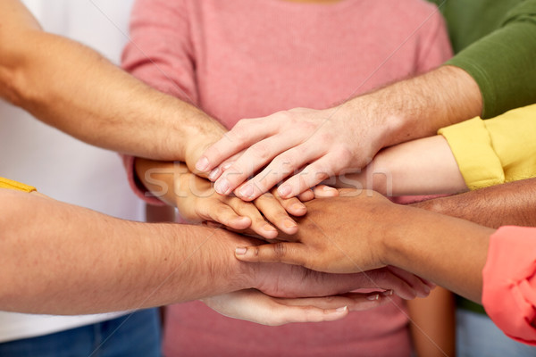 group of international people with hands together Stock photo © dolgachov