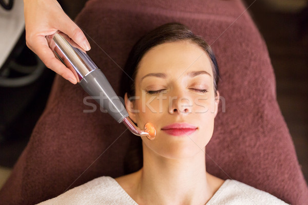 woman having hydradermie facial treatment in spa Stock photo © dolgachov