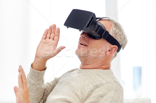 Stock photo: old man in virtual reality headset or 3d glasses