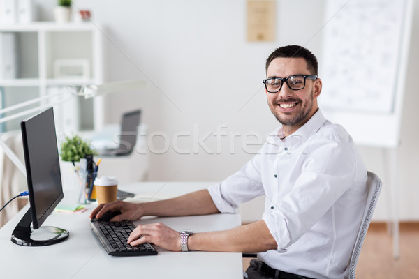 businessman typing on computer keyboard at office Stock photo © dolgachov