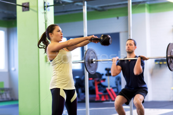 Adam kadın ağırlıklar egzersiz spor salonu spor Stok fotoğraf © dolgachov