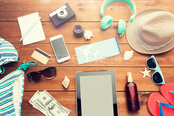 close up of tablet pc and travel stuff Stock photo © dolgachov