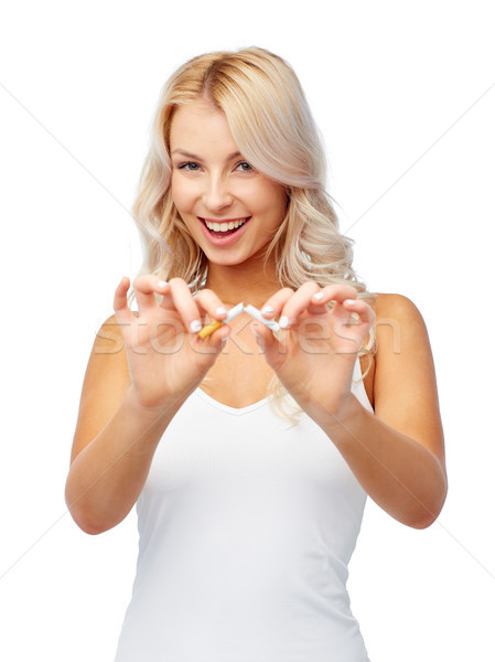 happy young woman breaking cigarette Stock photo © dolgachov