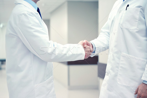close up of doctors making handshake Stock photo © dolgachov