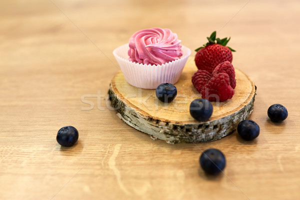 zephyr or marshmallow with berries on stand Stock photo © dolgachov