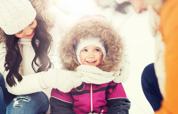 happy family with child in winter clothes outdoors Stock photo © dolgachov