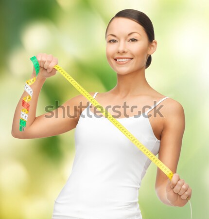 young beautiful woman with measure tape Stock photo © dolgachov