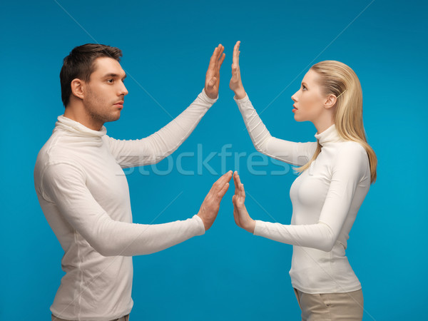 man and woman working with something imaginary Stock photo © dolgachov