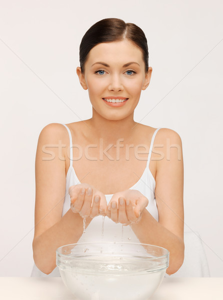 woman washing her face Stock photo © dolgachov