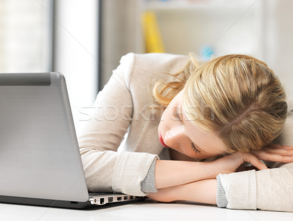 bored and tired woman sleeping on the table Stock photo © dolgachov