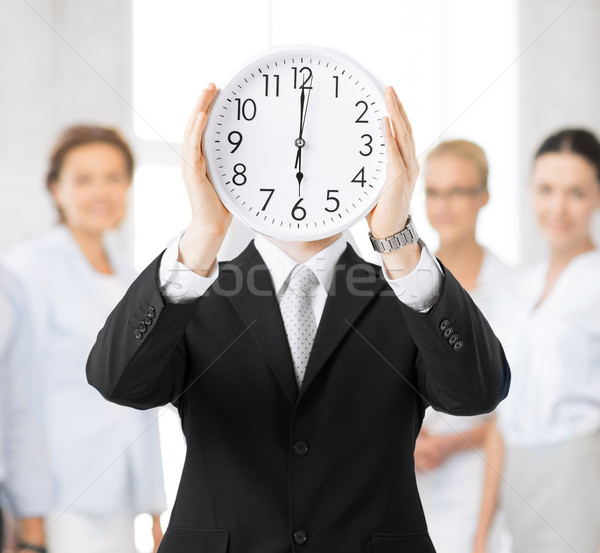 man with wall clock Stock photo © dolgachov