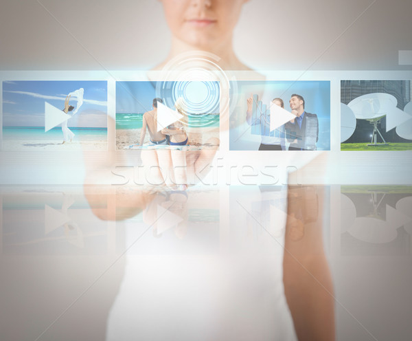 woman pressing button on virtual screen Stock photo © dolgachov