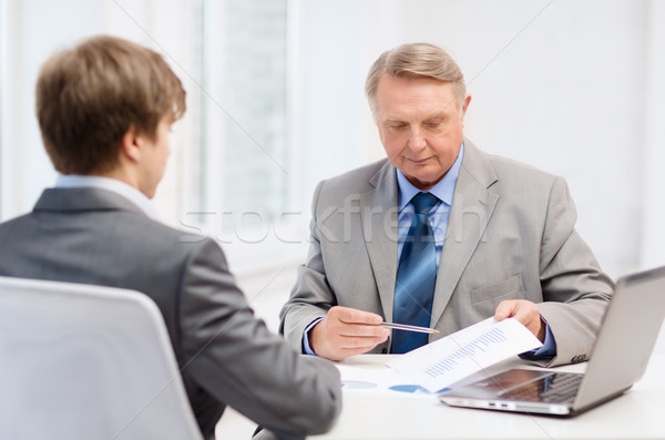 older man and young man having meeting in office Stock photo © dolgachov