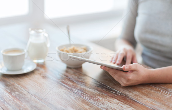 close up of woman reading news from tablet pc Stock photo © dolgachov