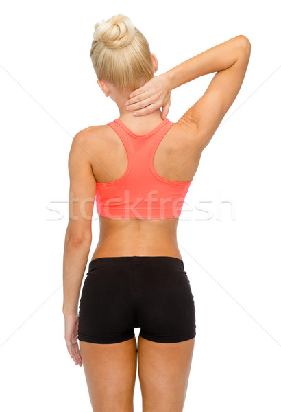 Stock photo: sporty woman touching her neck