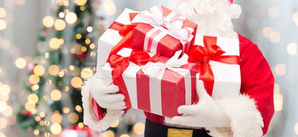 man in costume of santa claus with gift box Stock photo © dolgachov