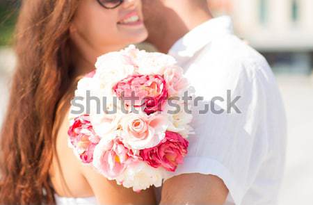 close up of happy lesbian couple with flowers Stock photo © dolgachov