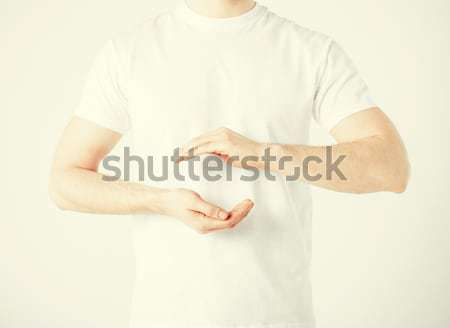 mans hands showing something Stock photo © dolgachov