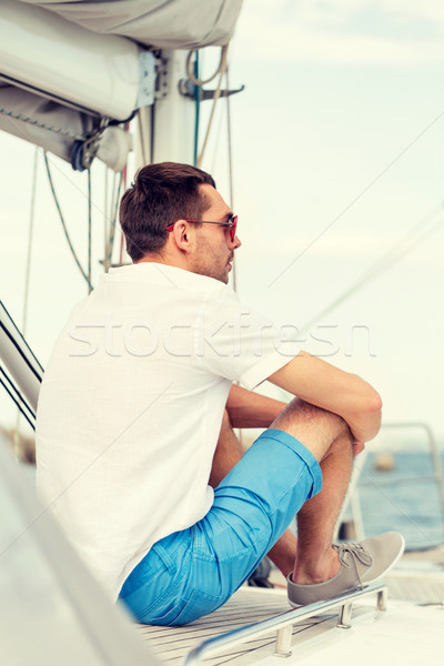 Férfi ül jacht fedélzet vakáció ünnepek Stock fotó © dolgachov