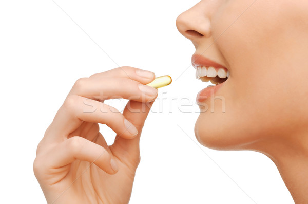 Güzel bir kadın omega 3 vitaminler sağlık güzellik kadın Stok fotoğraf © dolgachov