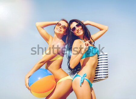 Stock photo: two smiling women making selfie on beach