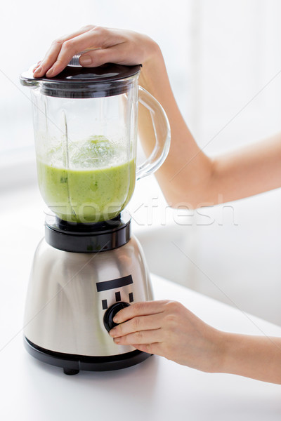 close up of woman hands with blender making shake Stock photo © dolgachov