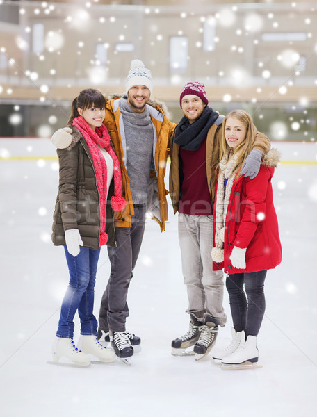 happy friends on skating rink Stock photo © dolgachov