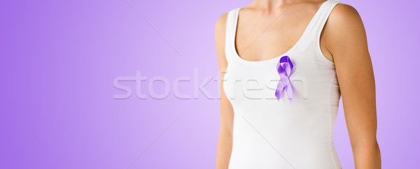 close up of woman with purple awareness ribbon Stock photo © dolgachov