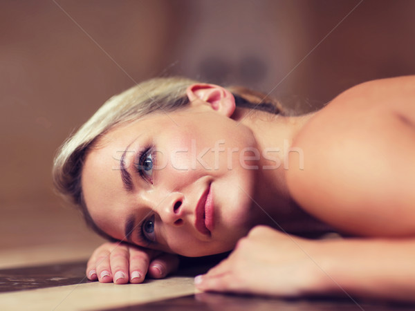 young woman lying on hammam table in turkish bath Stock photo © dolgachov