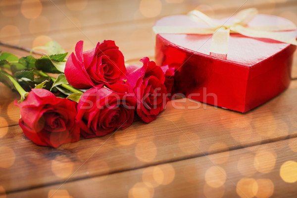 close up of heart shaped gift box and red roses Stock photo © dolgachov