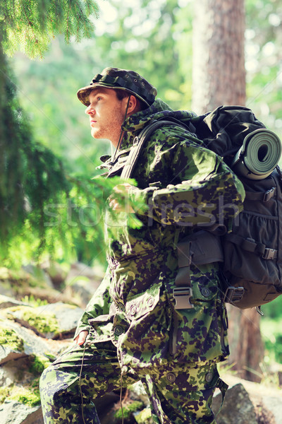 young soldier with backpack in forest Stock photo © dolgachov
