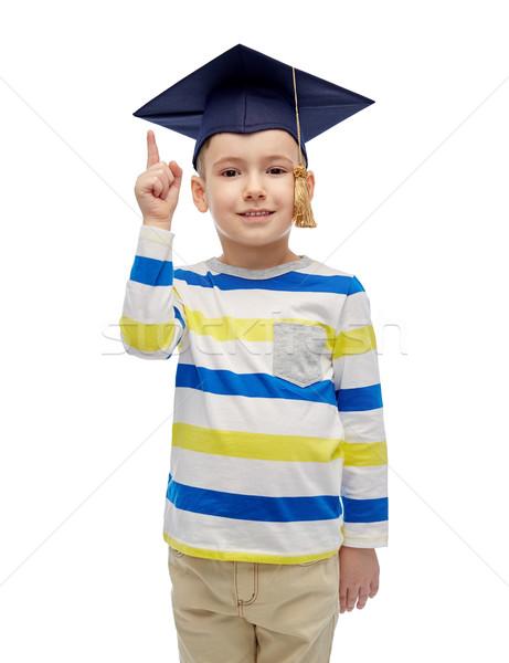 Vidám fiú agglegény kalap mutat ujj felfelé Stock fotó © dolgachov