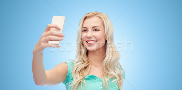 Stockfoto: Glimlachend · jonge · vrouw · smartphone · emoties · uitdrukkingen