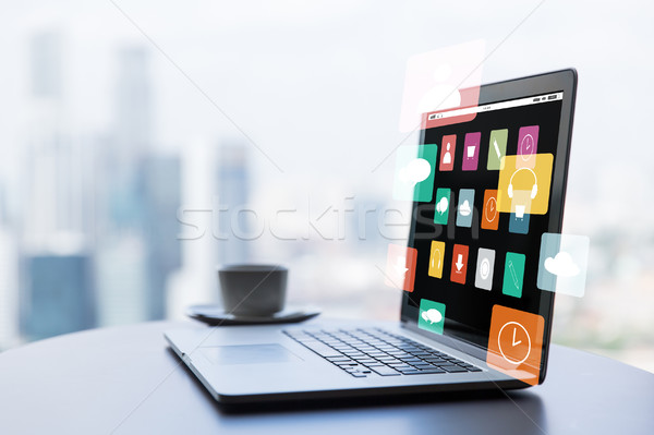 close up of laptop and coffee cup on office table Stock photo © dolgachov