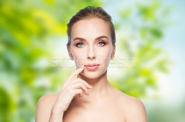 beautiful young woman showing her lips Stock photo © dolgachov