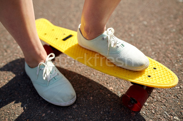 close up of female feet riding short skateboard Stock photo © dolgachov