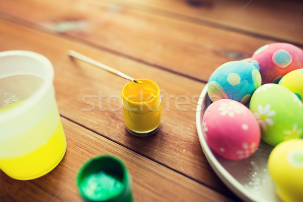 close up of colored easter eggs on plate Stock photo © dolgachov