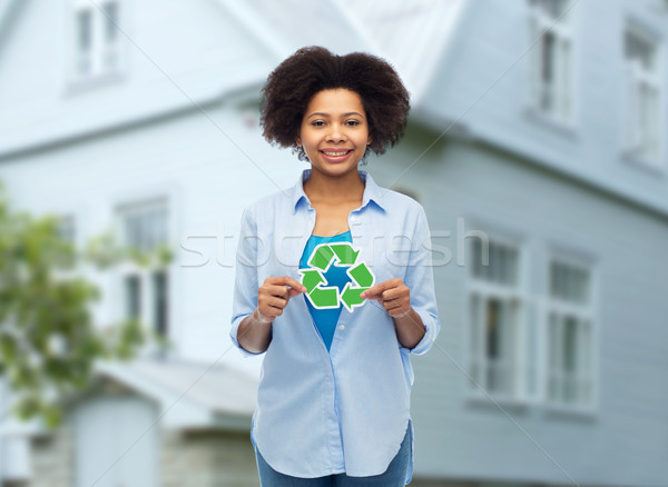 happy afro american woman over house background Stock photo © dolgachov