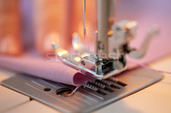 sewing machine presser foot stitching fabric Stock photo © dolgachov