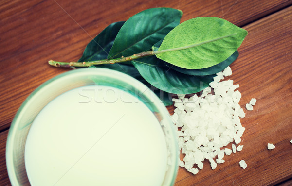 close up of citrus body lotion in bowl on wood Stock photo © dolgachov