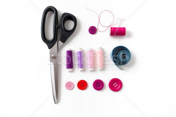 Stock photo: scissors, sewing buttons, threads and tape measure